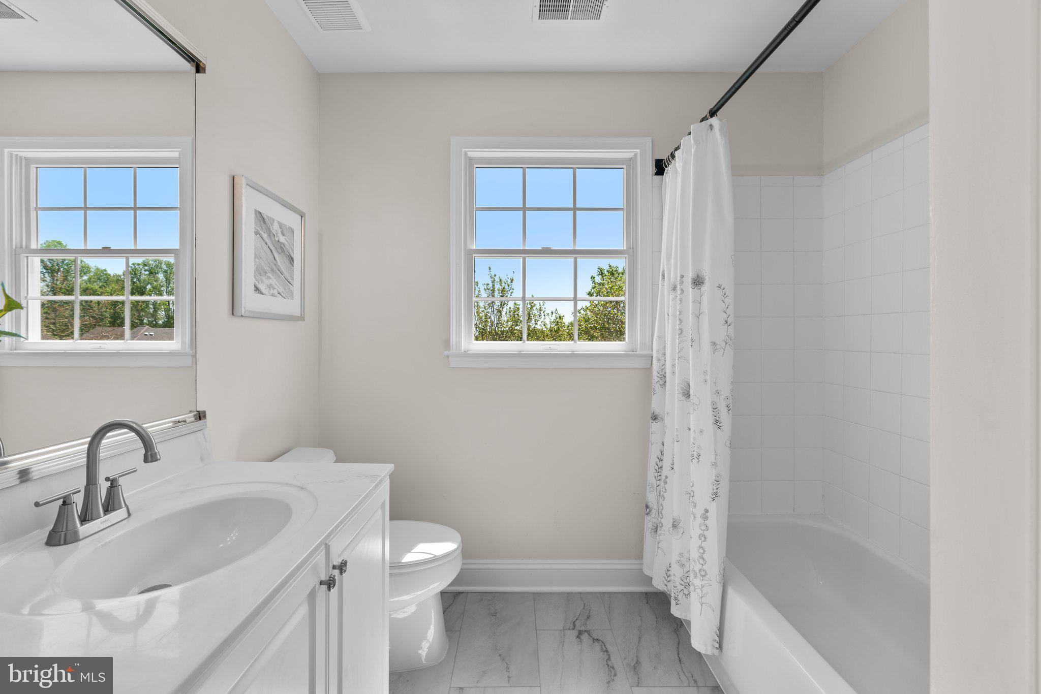 22104 Ginger Tree Way Clarksburg, MD 20871 - Photo 47 of 57 a bathroom with a sink toilet and shower