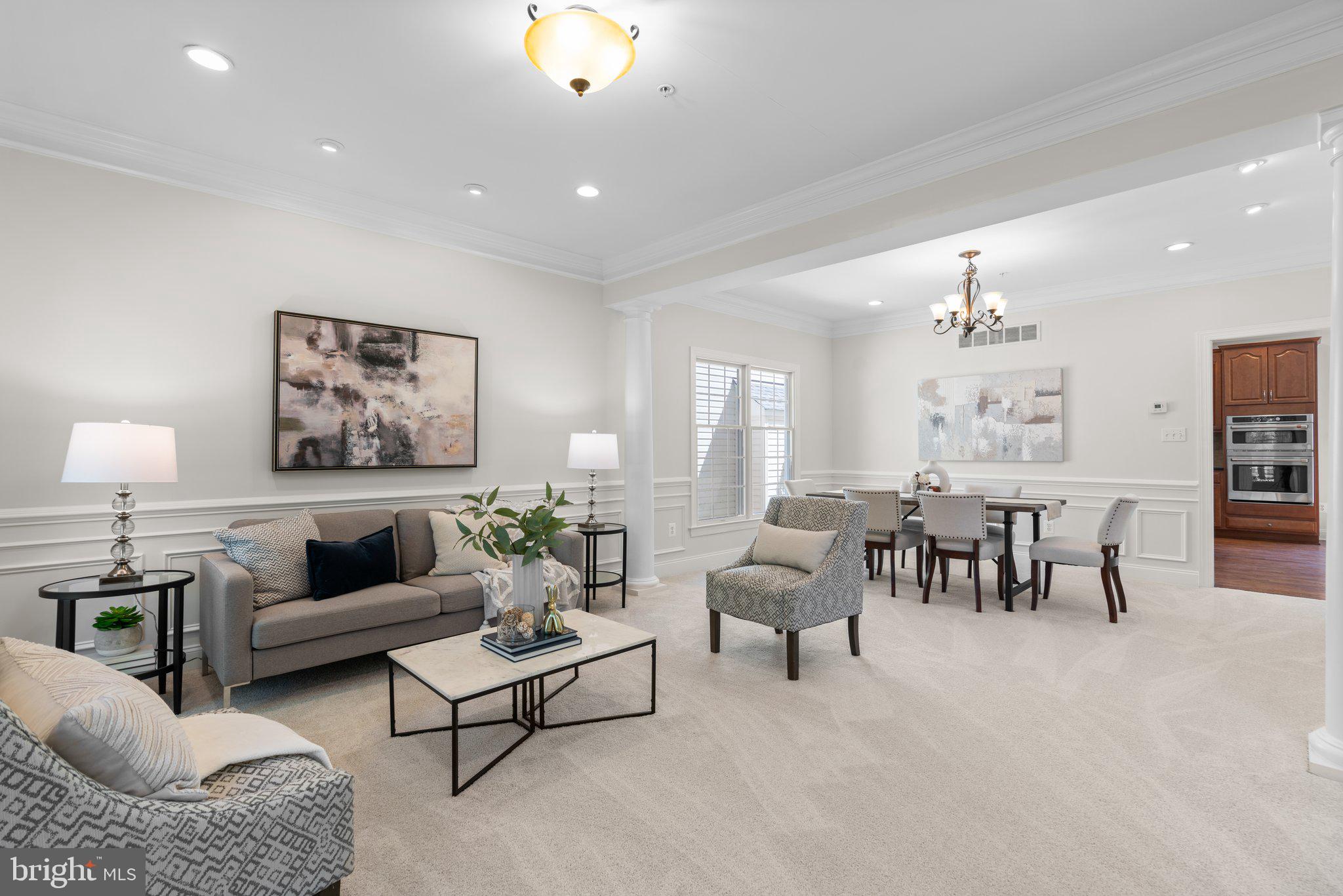 22104 Ginger Tree Way Clarksburg, MD 20871 - Photo 5 of 57 a living room with furniture and a large window