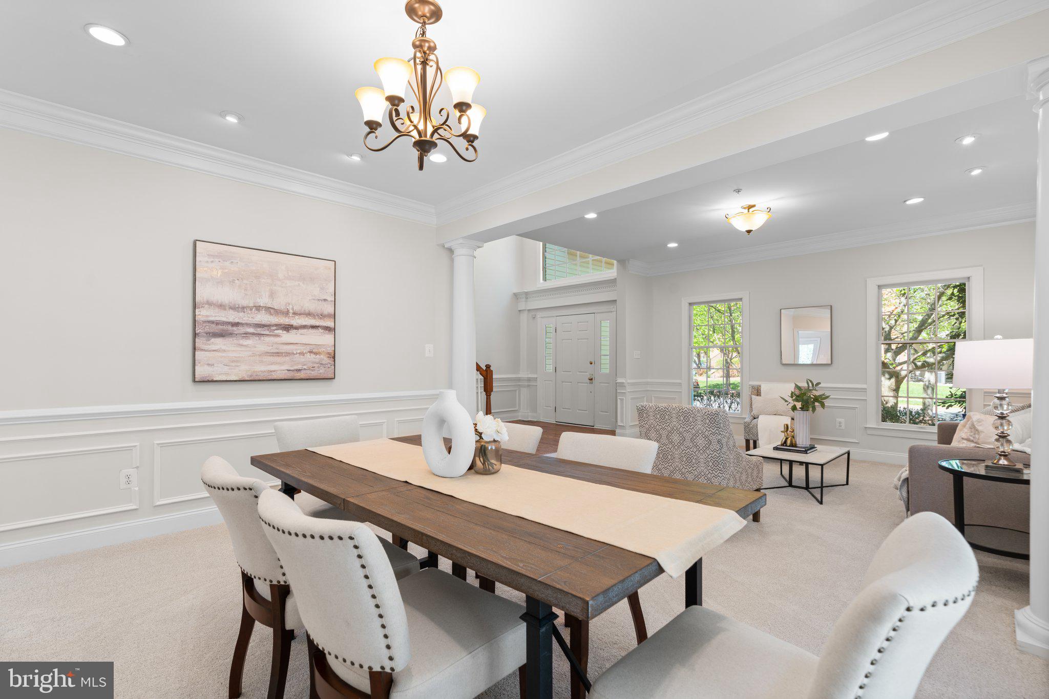 22104 Ginger Tree Way Clarksburg, MD 20871 - Photo 9 of 57 a view of a dining room with furniture window and wooden floor