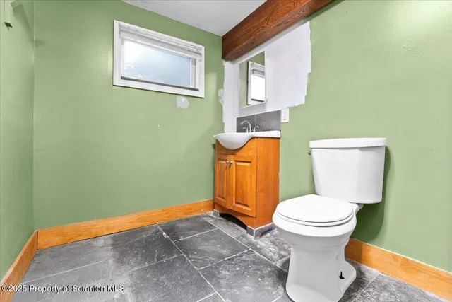 a bathroom with a toilet and a sink