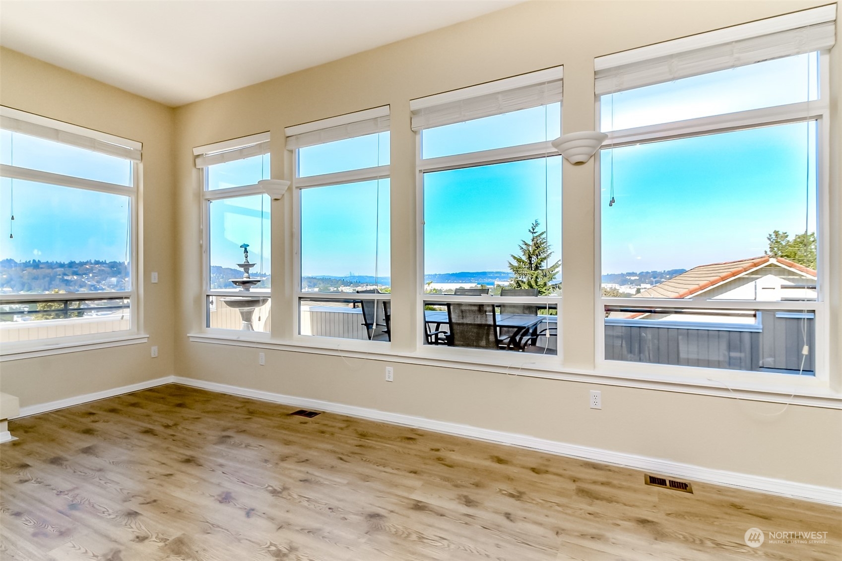 350 Renton Avenue South Renton, WA 98057 - Photo 8 of 40 a view of an empty room with wooden floor and a window