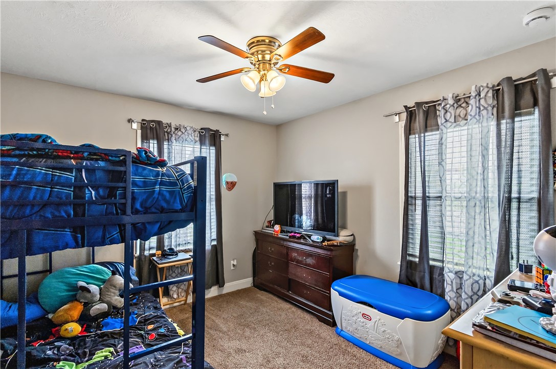 112 Ehlinger Drive Bryan, TX 77801 - Photo 13 of 18 a living room with furniture a flat screen tv and a window