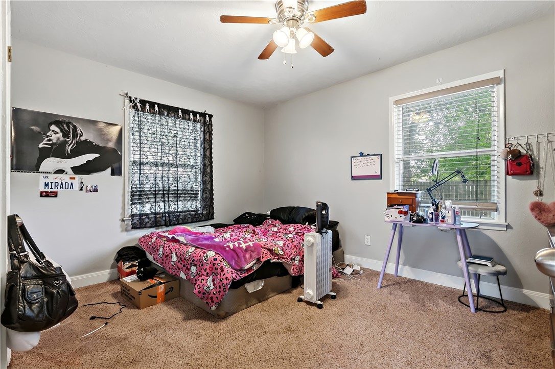 112 Ehlinger Drive Bryan, TX 77801 - Photo 14 of 18 a bedroom with a bed and a window