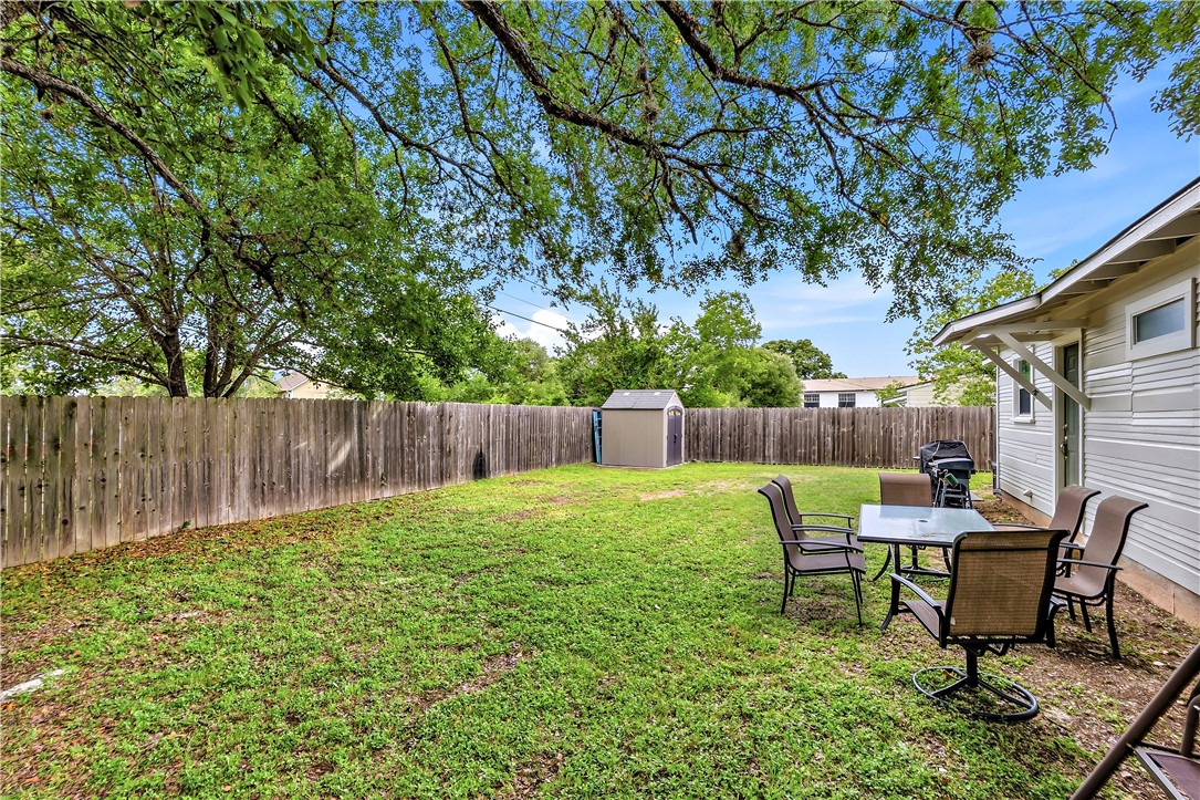 112 Ehlinger Drive Bryan, TX 77801 - Photo 17 of 18 a backyard of a house with table and chairs