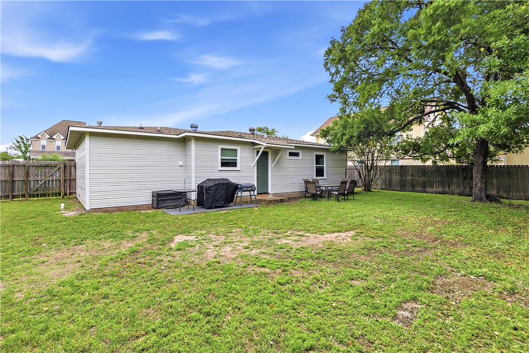 112 Ehlinger Drive Bryan, TX 77801 - Photo 18 of 18 a view of a house with backyard and a garden