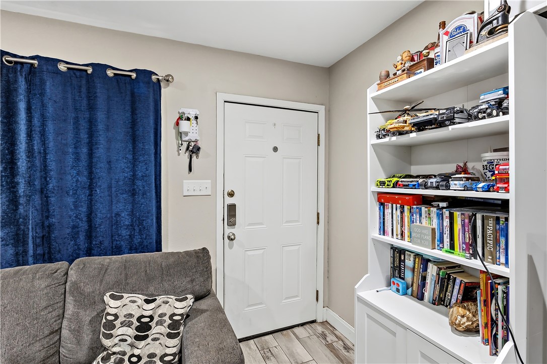 112 Ehlinger Drive Bryan, TX 77801 - Photo 2 of 18 a living room with furniture and a book shelf