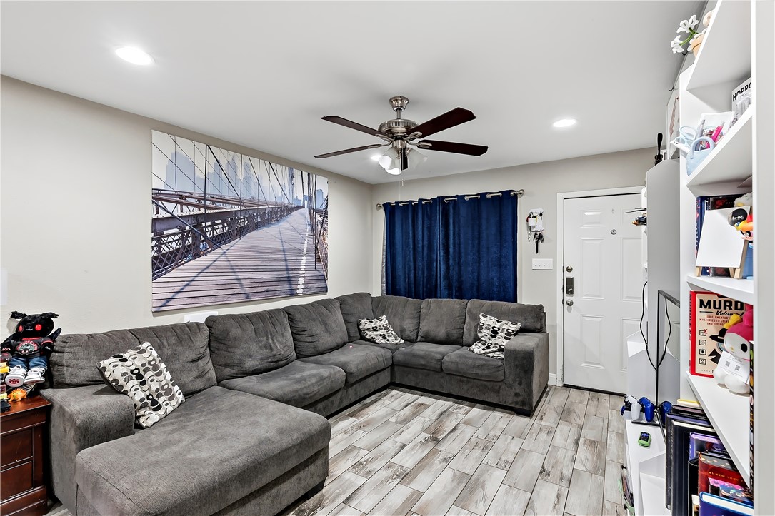 112 Ehlinger Drive Bryan, TX 77801 - Photo 4 of 18 a living room with furniture and a flat screen tv