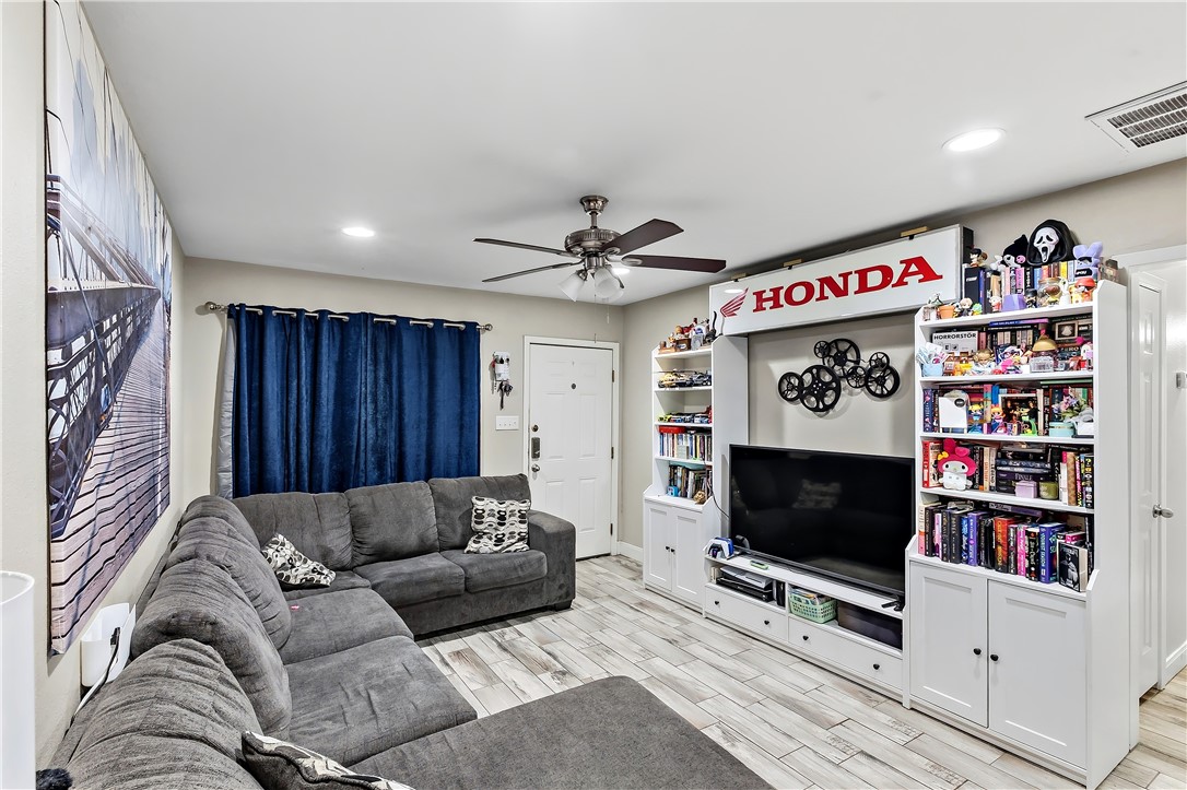 112 Ehlinger Drive Bryan, TX 77801 - Photo 5 of 18 a living room with furniture and a flat screen tv