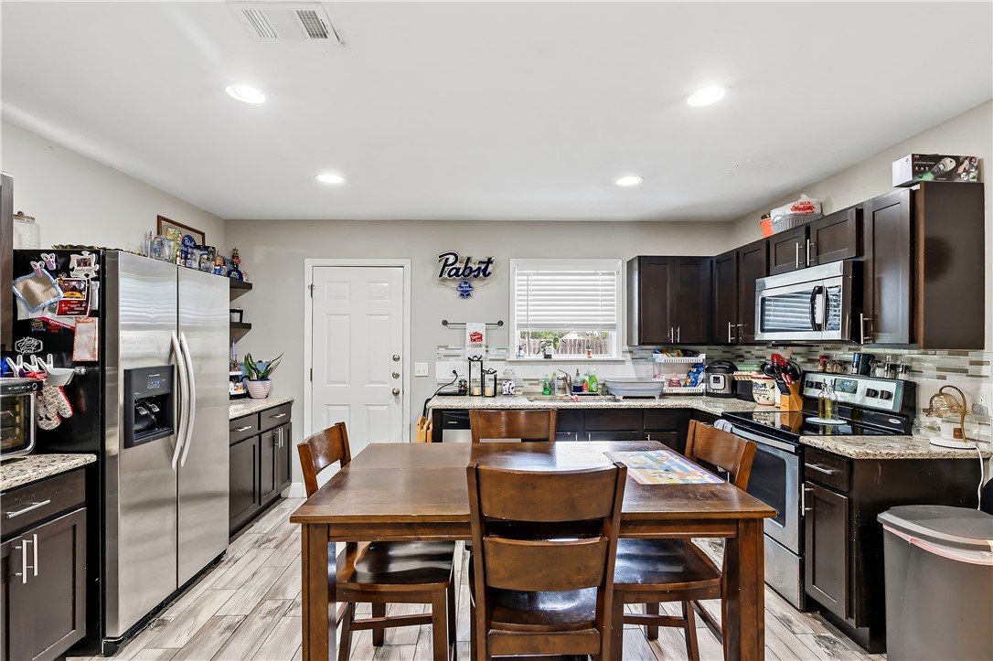 112 Ehlinger Drive Bryan, TX 77801 - Photo 6 of 18 a view of a dining room with furniture