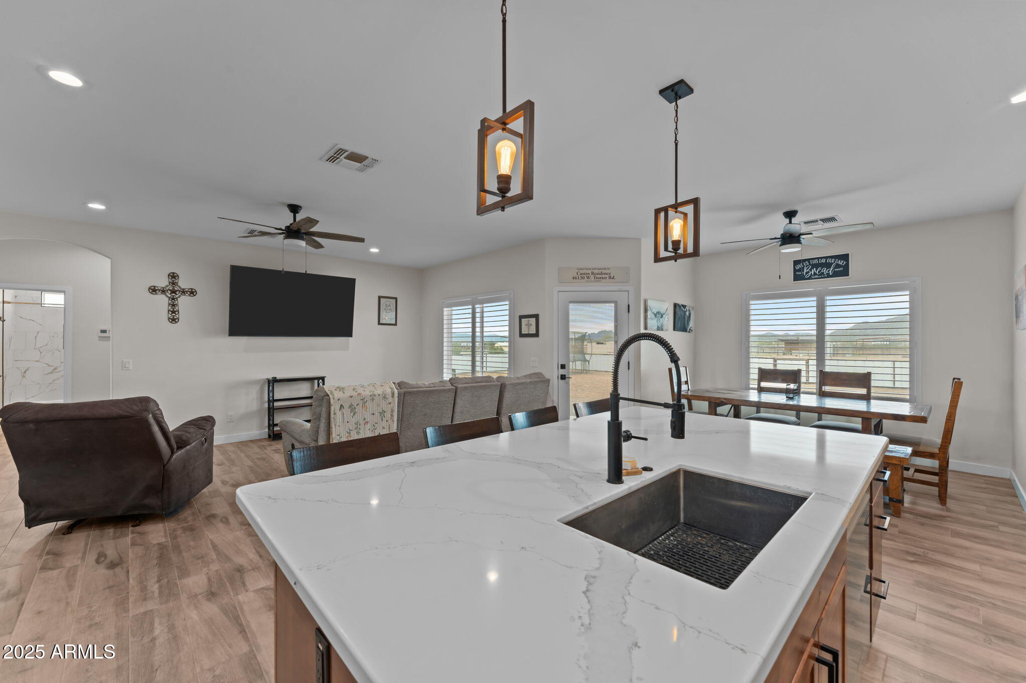 46130 West Trotter Road Wickenburg, AZ 85390 - Photo 12 of 55 a living room with furniture and a flat screen tv