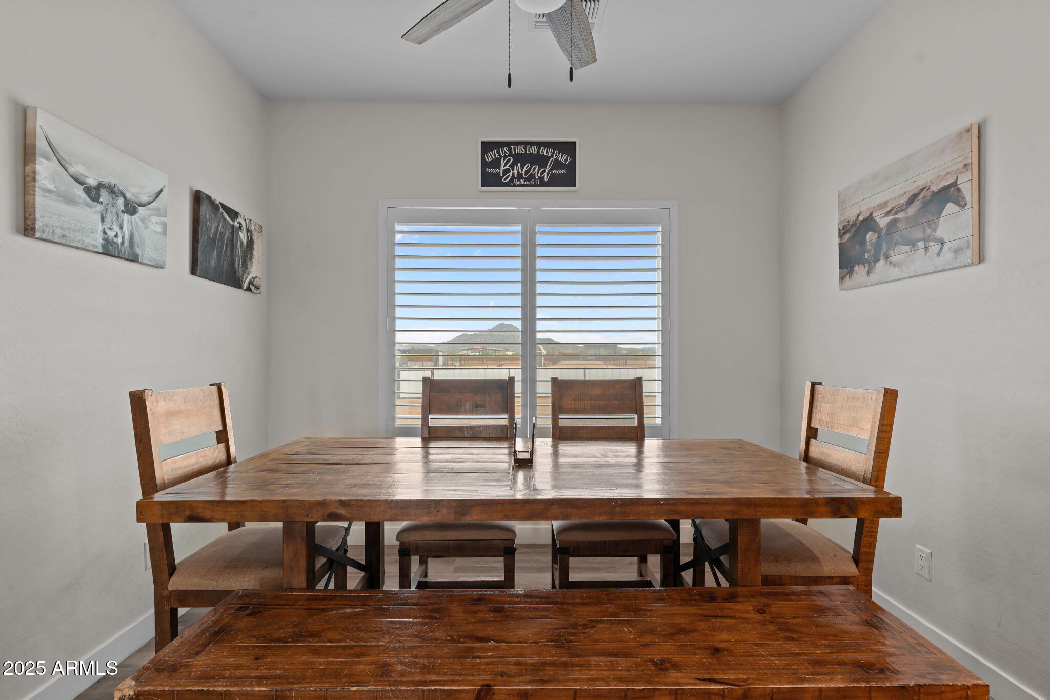 46130 West Trotter Road Wickenburg, AZ 85390 - Photo 13 of 55 a view of a dining room with furniture window and wooden floor