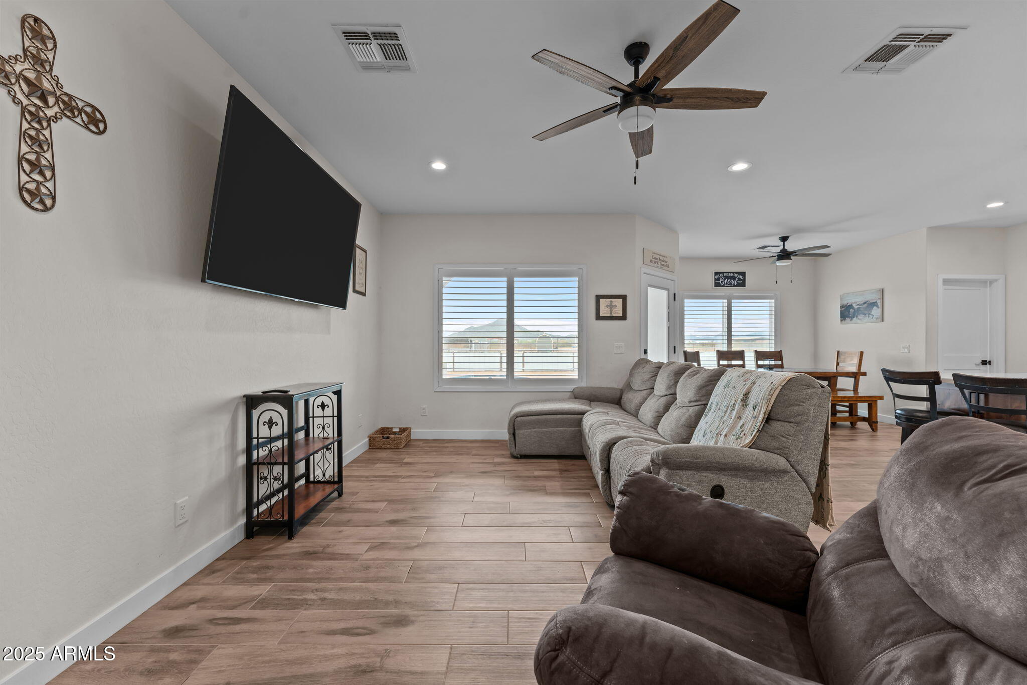 46130 West Trotter Road Wickenburg, AZ 85390 - Photo 16 of 55 a living room with furniture and a flat screen tv