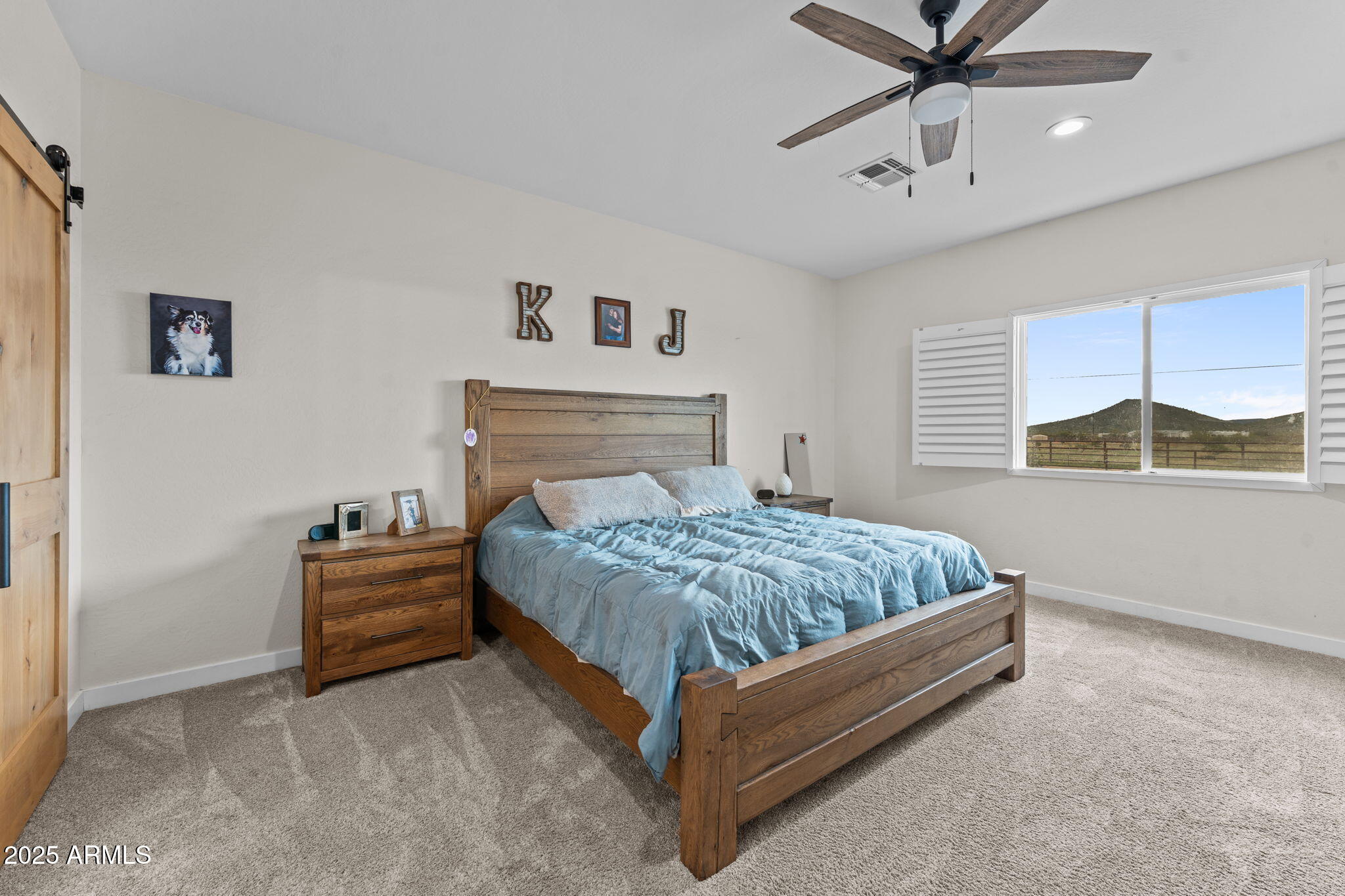 46130 West Trotter Road Wickenburg, AZ 85390 - Photo 19 of 55 a bedroom with a bed and window