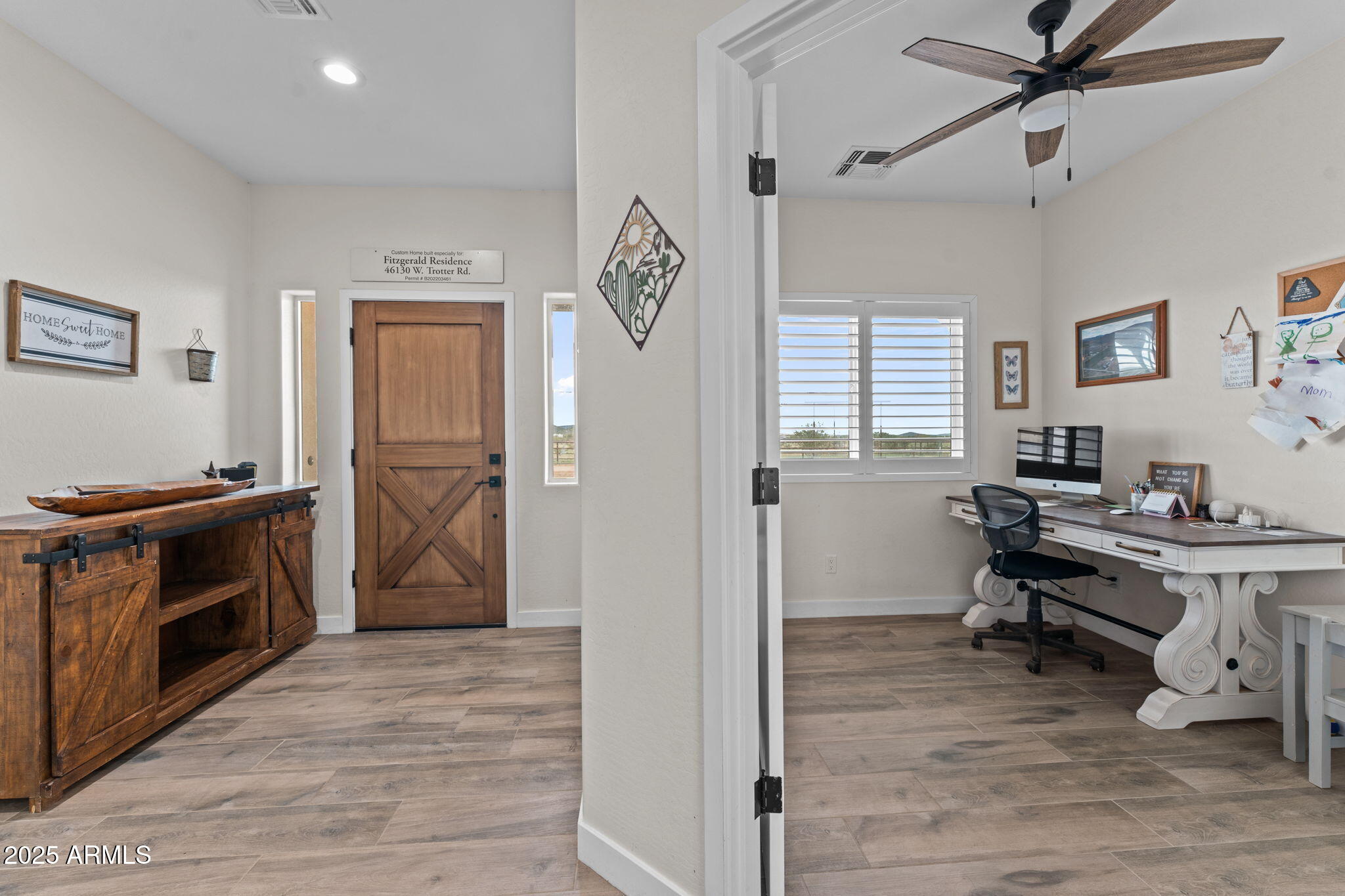 46130 West Trotter Road Wickenburg, AZ 85390 - Photo 25 of 55 a view of a workspace with wooden floor and a window