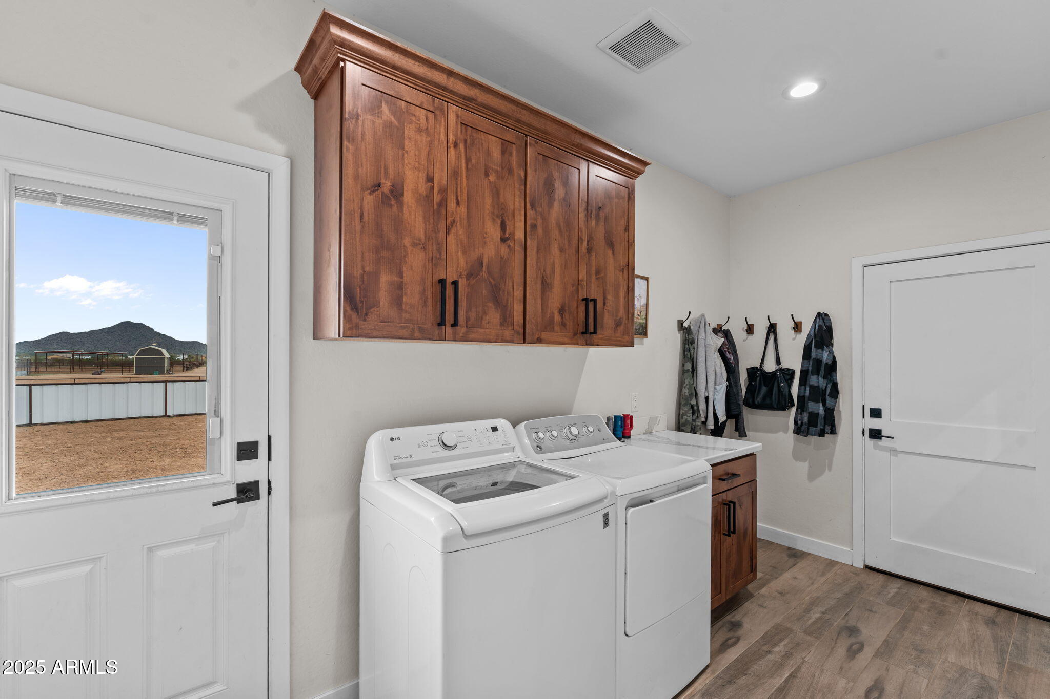 46130 West Trotter Road Wickenburg, AZ 85390 - Photo 27 of 55 a view of walk in closet with clothes and shoes