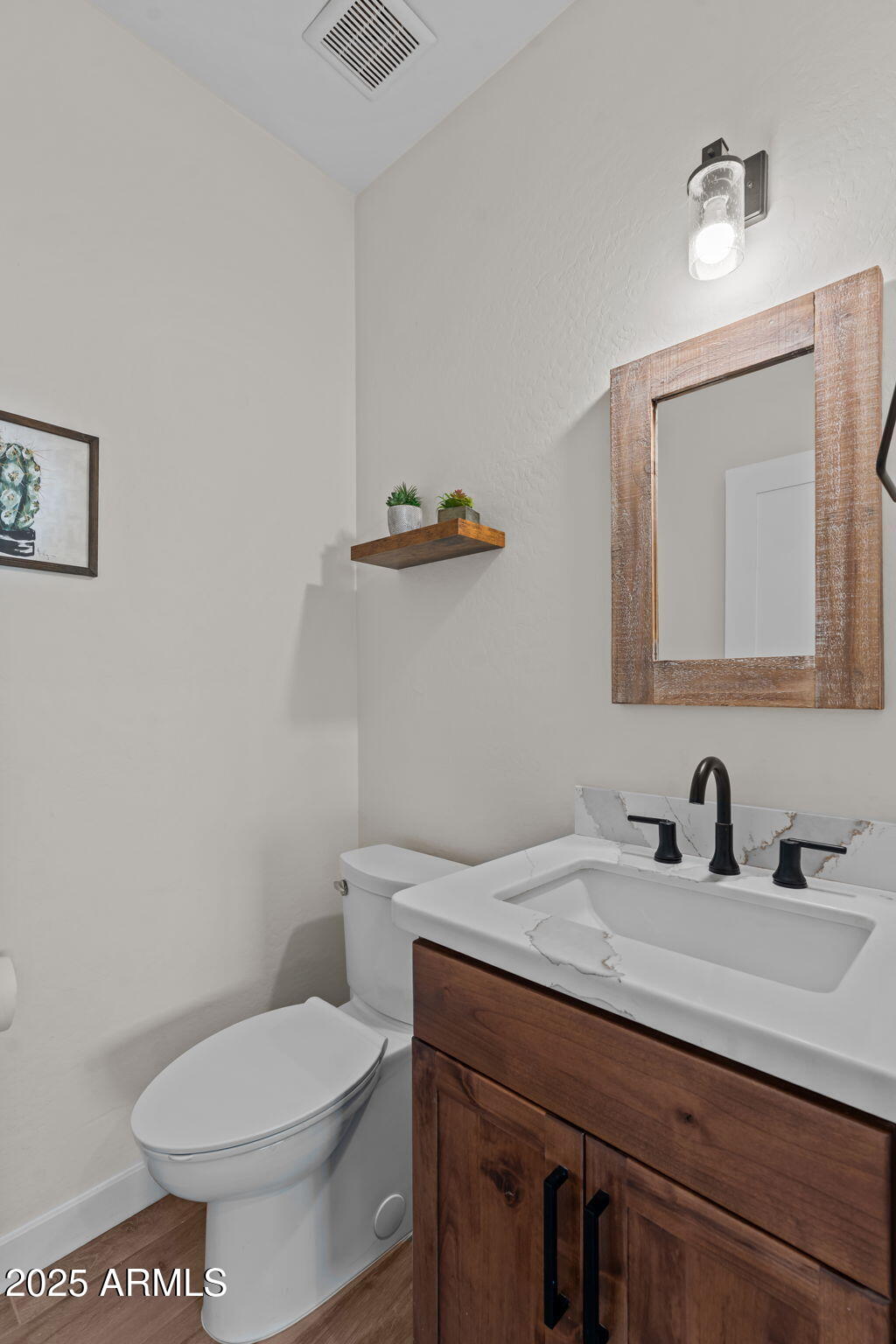 46130 West Trotter Road Wickenburg, AZ 85390 - Photo 28 of 55 a bathroom with a toilet a sink and mirror