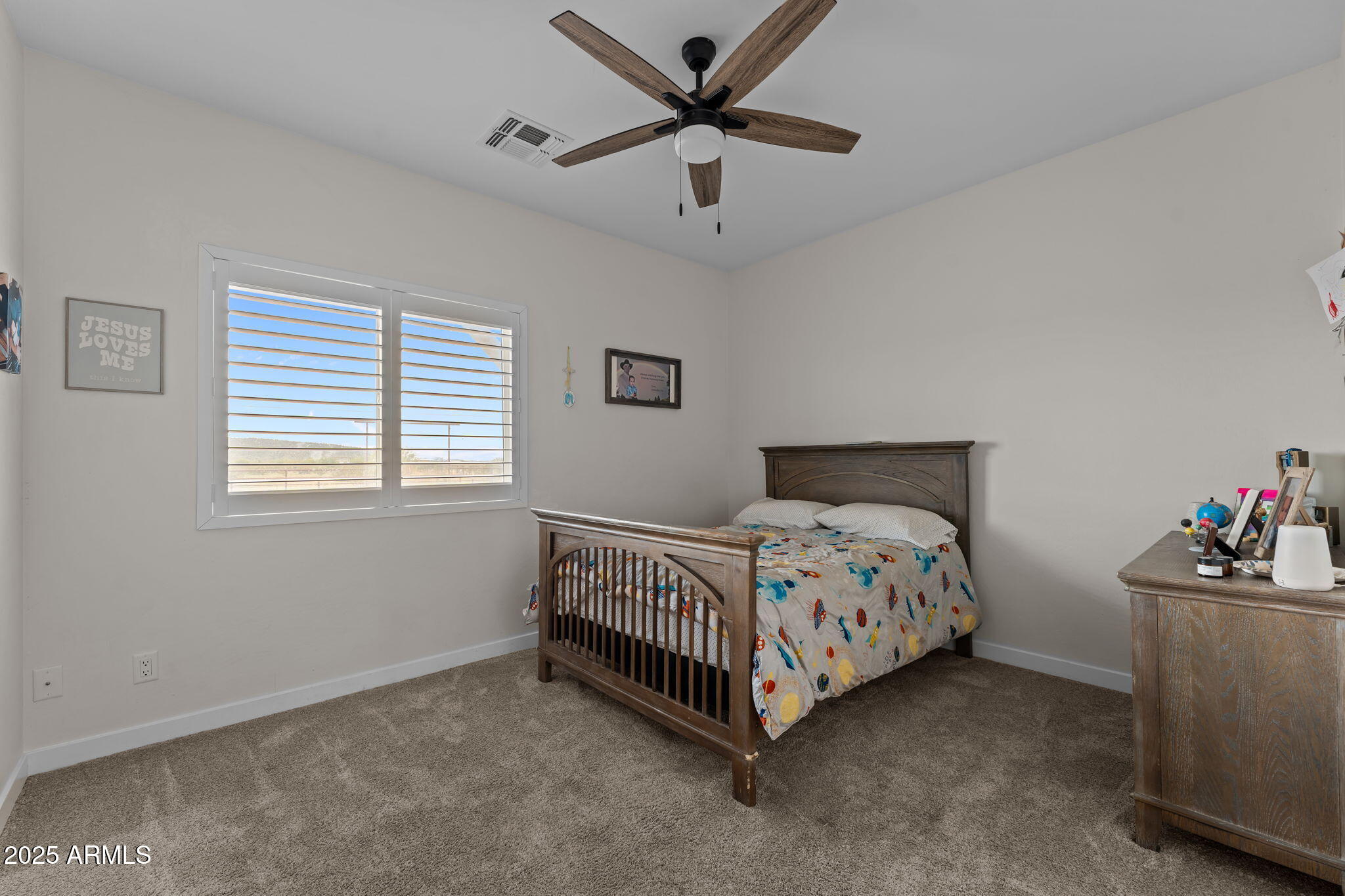 46130 West Trotter Road Wickenburg, AZ 85390 - Photo 29 of 55 a bedroom with a bed chandelier and a window