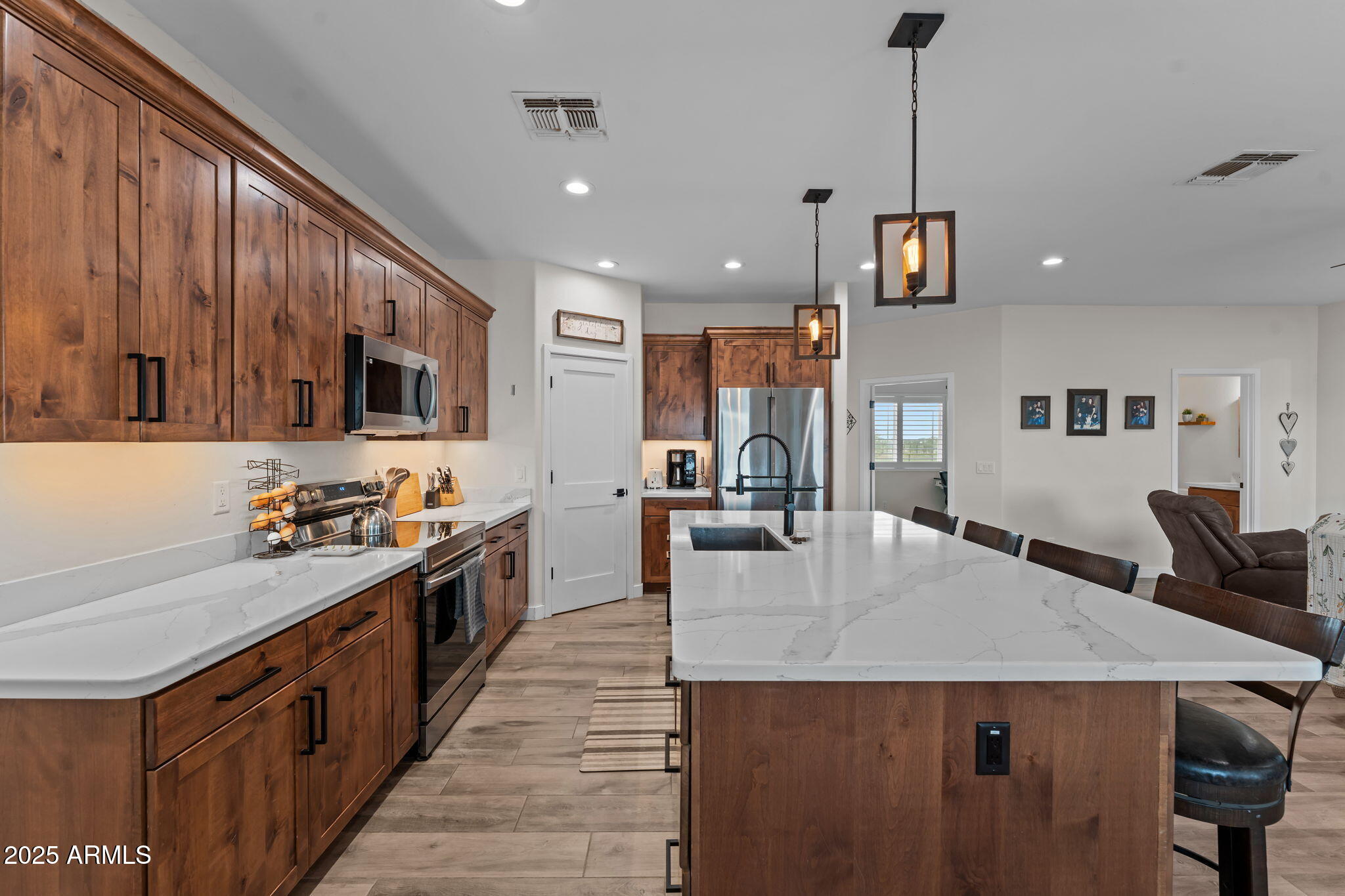 46130 West Trotter Road Wickenburg, AZ 85390 - Photo 10 of 55 a kitchen with sink a stove and chairs