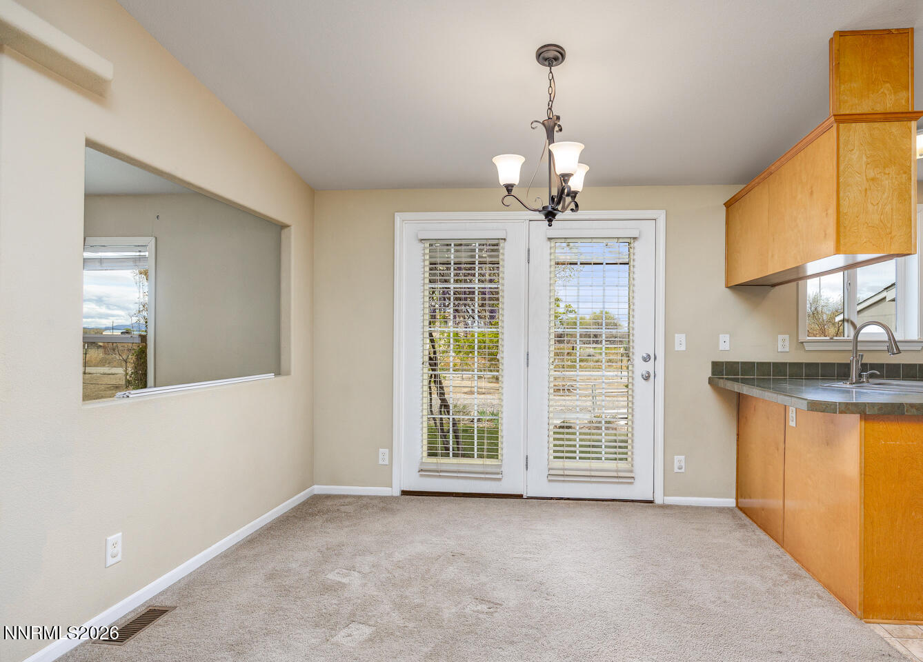 4141 Schindler Road Fallon, NV 89406 - Photo 12 of 25 a view of livingroom with chandelier fan and windows