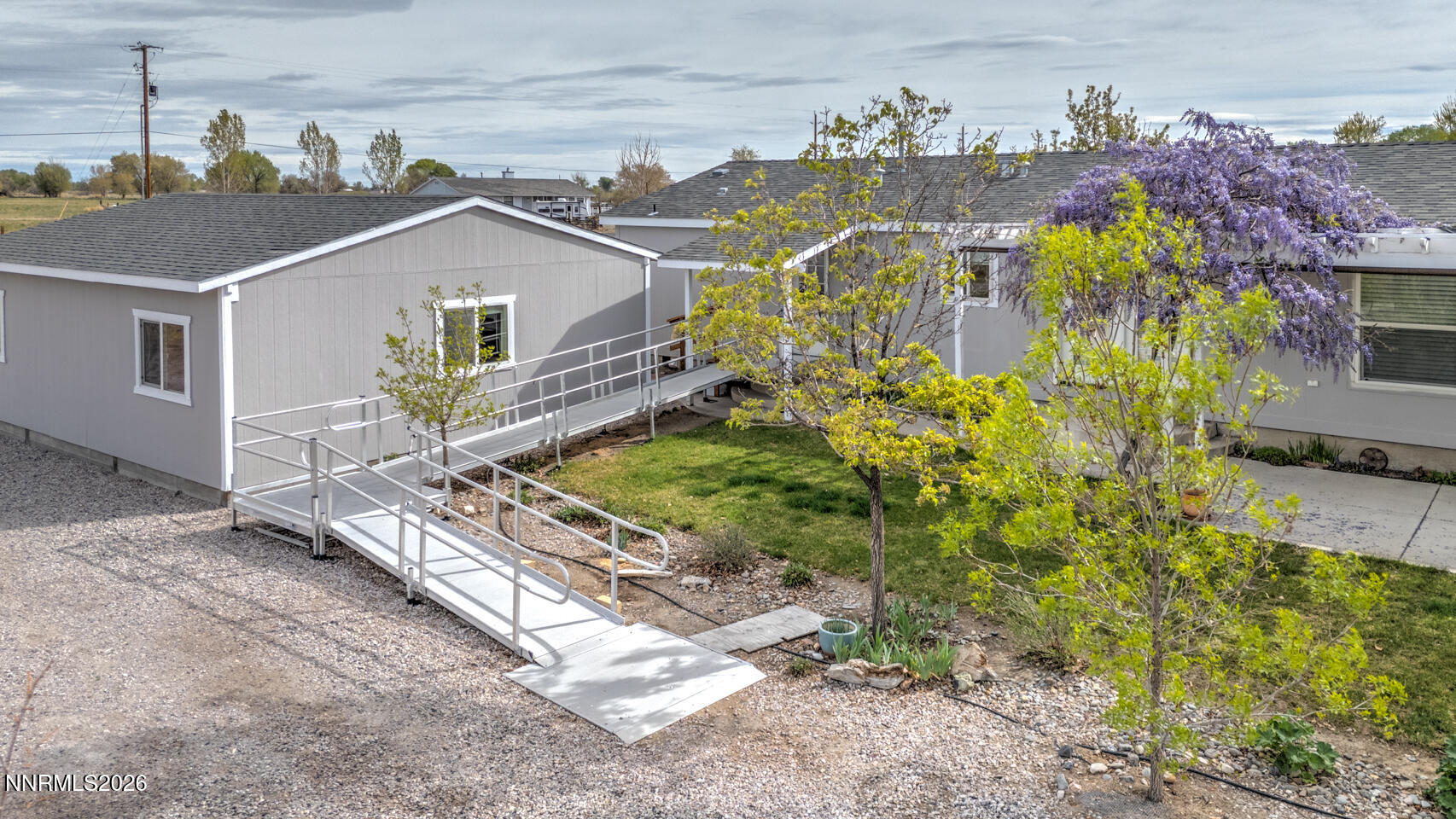 4141 Schindler Road Fallon, NV 89406 - Photo 24 of 25 a view of a house with a yard and potted plants
