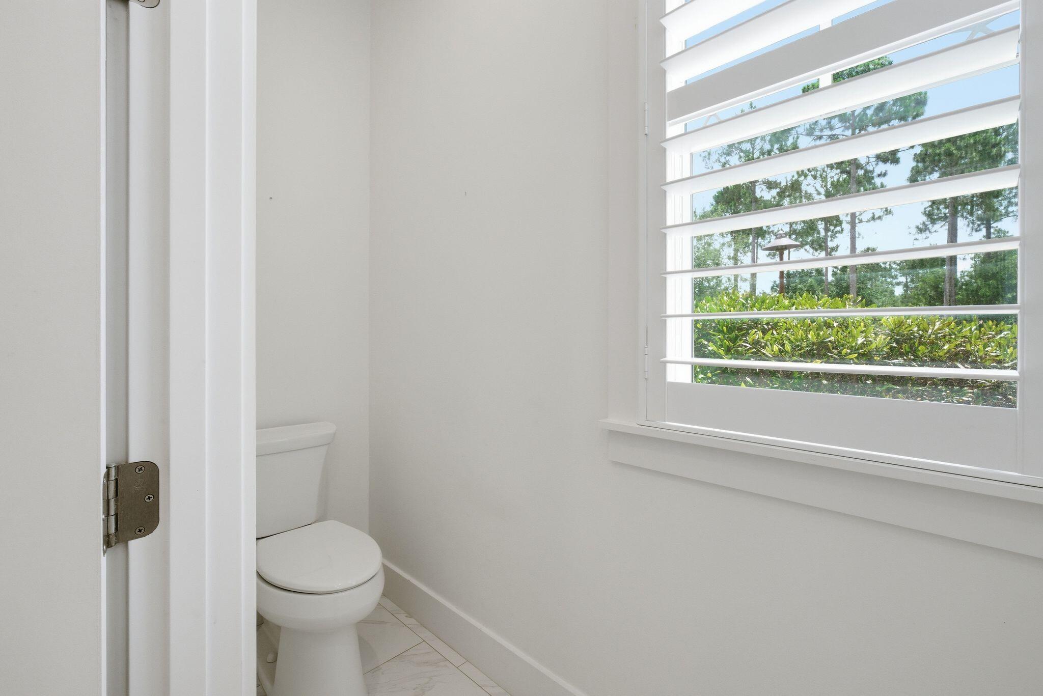 133 Sandchase Circle, Unit LOT 15 Inlet Beach, FL 32461 - Photo 17 of 47 a bathroom with a toilet and a shower