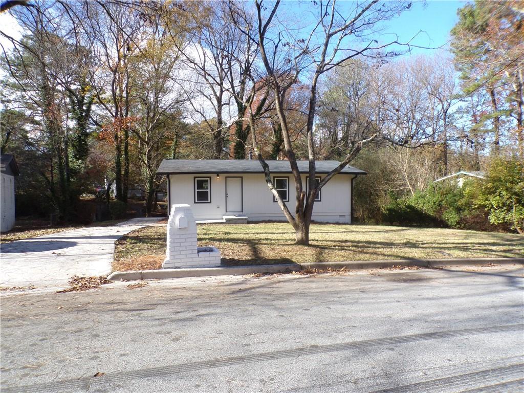 1070 Fairburn Road Southwest Atlanta, GA 30331 - Photo 1 of 1 a view of a house with snow on the road