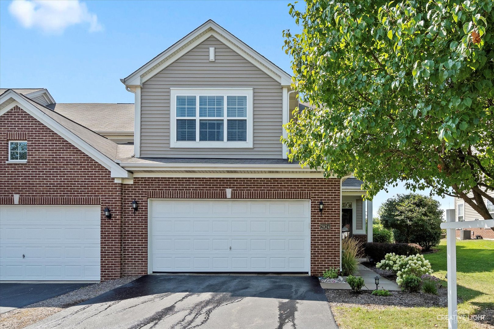 2824 Church Road Aurora, IL 60502 - Photo 1 of 20 a front view of a house with a yard