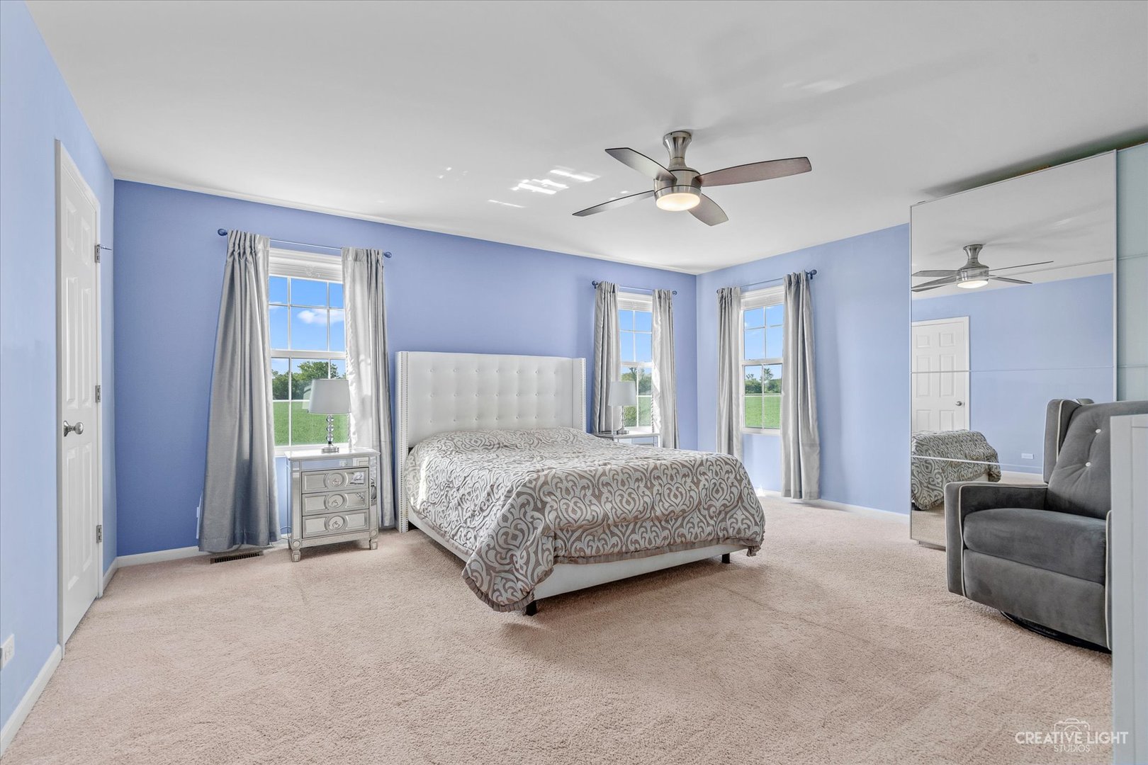 2824 Church Road Aurora, IL 60502 - Photo 12 of 20 a bedroom with a large bed chandelier and a window