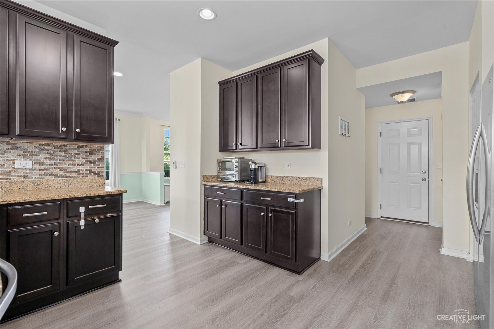 2824 Church Road Aurora, IL 60502 - Photo 9 of 20 a kitchen with stainless steel appliances granite countertop wooden cabinets and a sink
