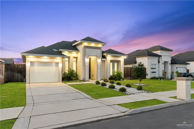 a front view of a house with a yard table and chairs