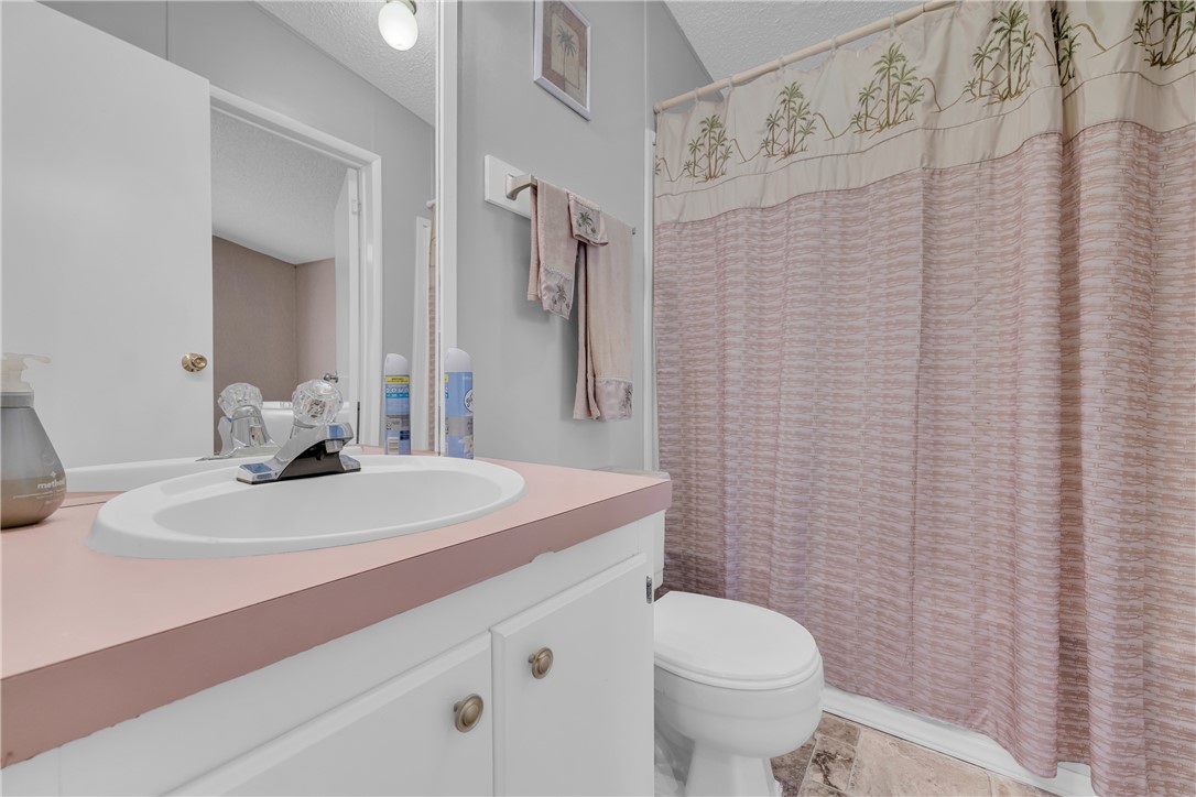 721 Cedar Crest Trail Walhalla, SC 29691 - Photo 27 of 47 A well-lit bathroom features a functional vanity and a clean shower area.