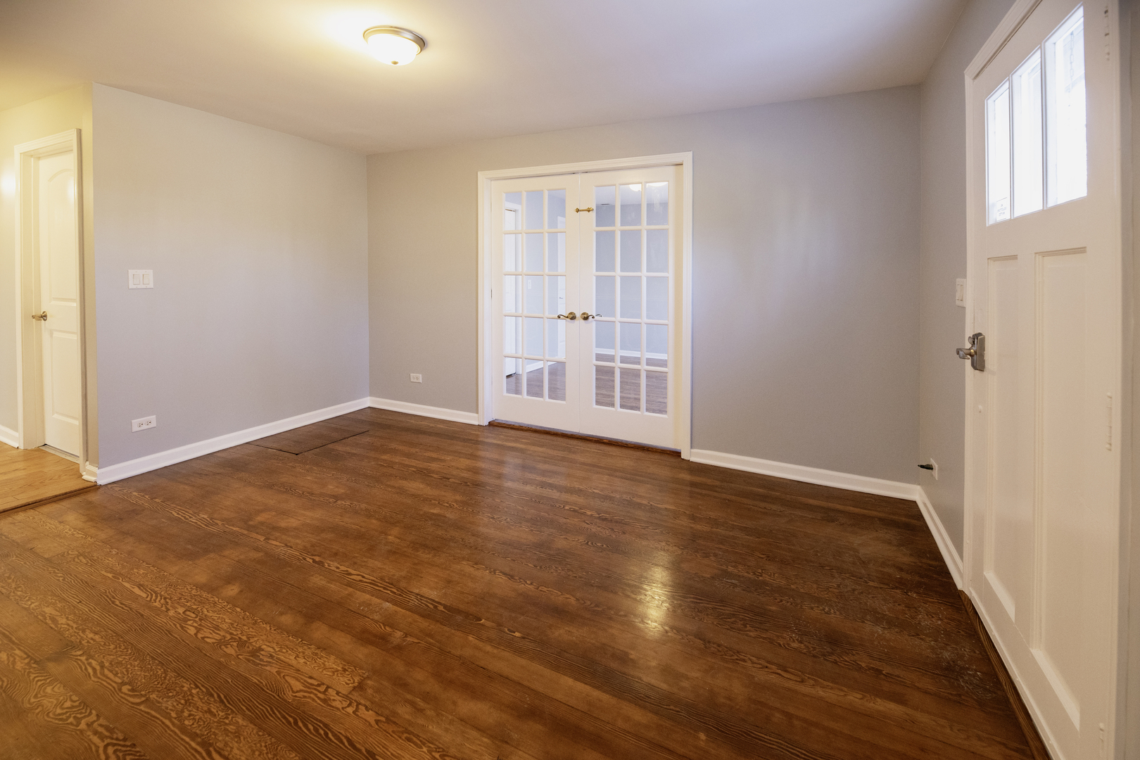 2015 Greenview Road Northbrook, IL 60062 - Photo 11 of 17 an empty room with wooden floor and windows