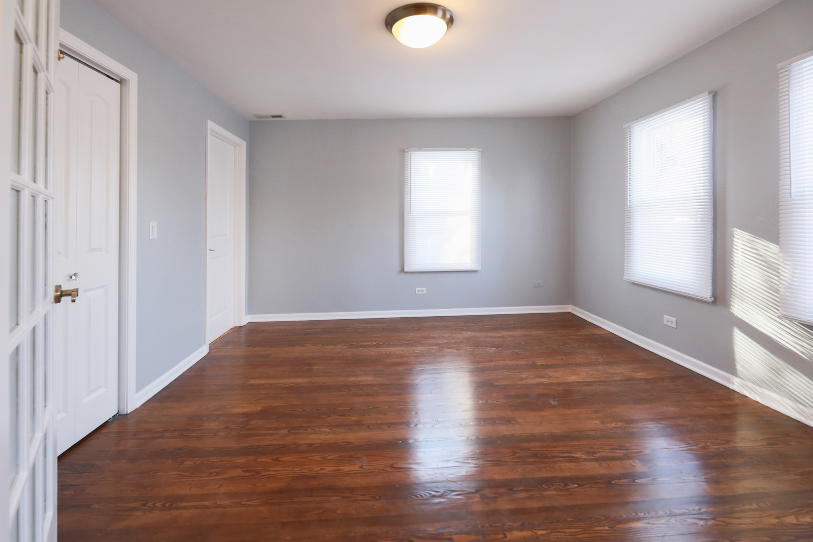 2015 Greenview Road Northbrook, IL 60062 - Photo 12 of 17 an empty room with wooden floor and windows