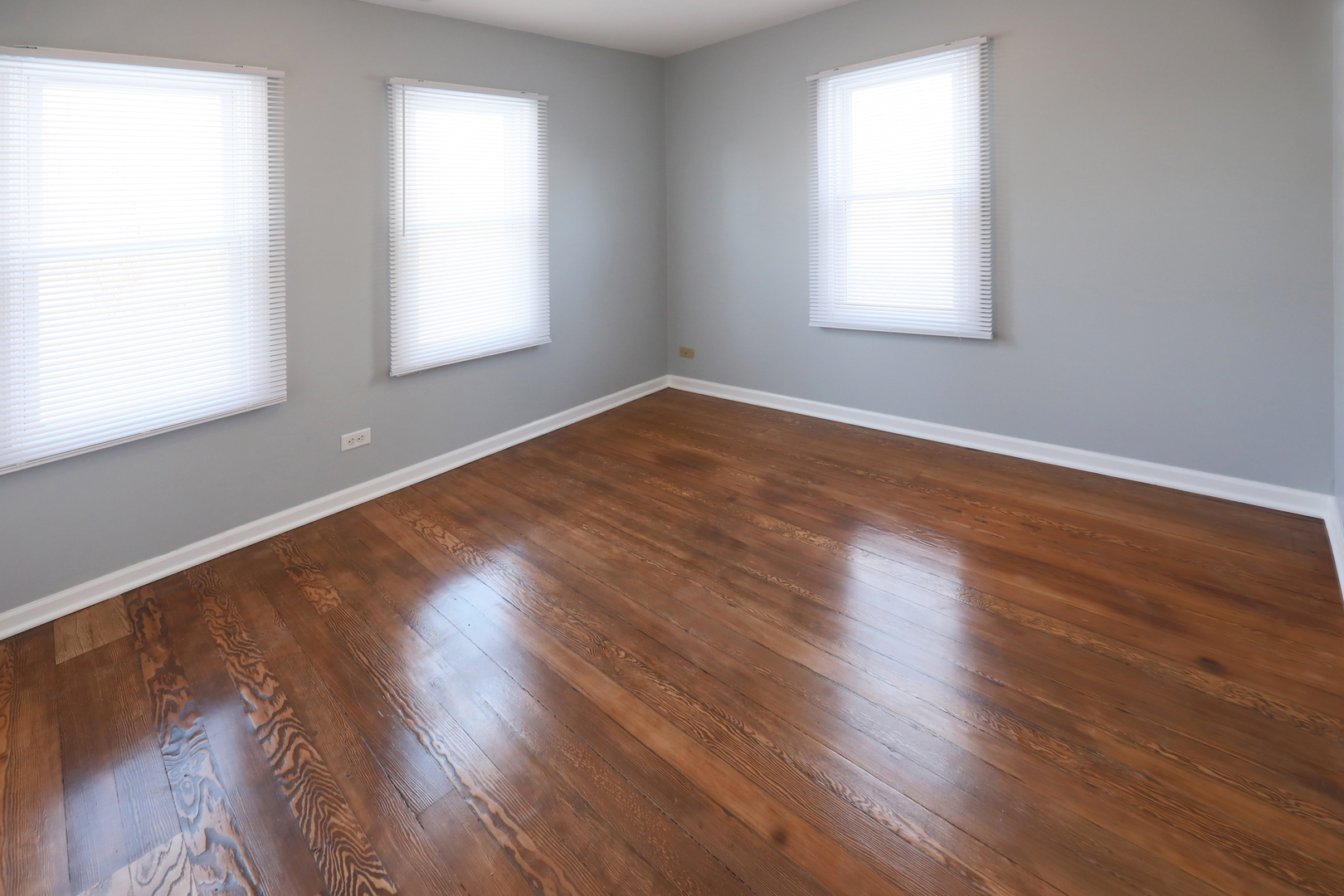 2015 Greenview Road Northbrook, IL 60062 - Photo 13 of 17 an empty room with wooden floor and windows