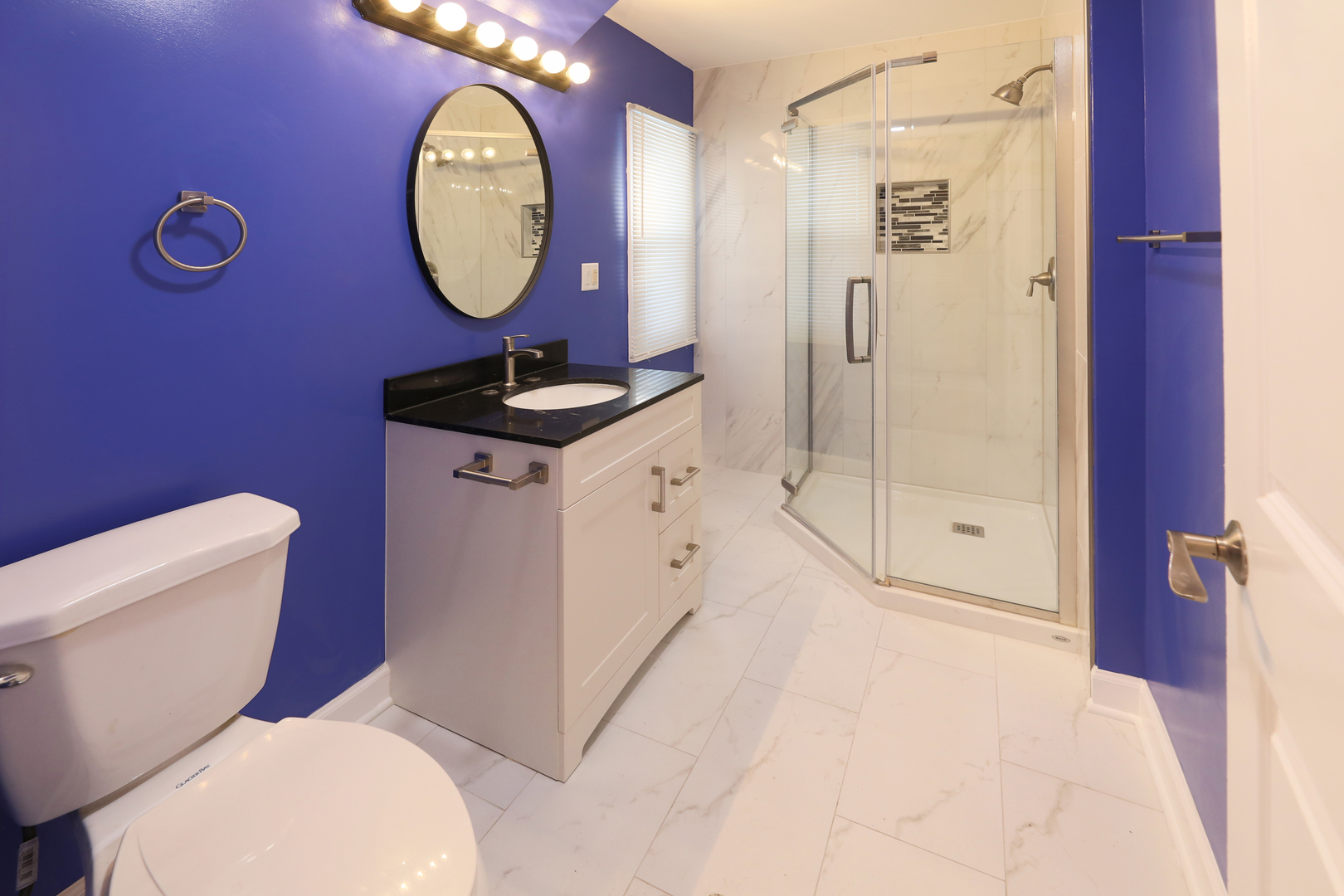 2015 Greenview Road Northbrook, IL 60062 - Photo 14 of 17 a bathroom with a toilet a sink and a mirror