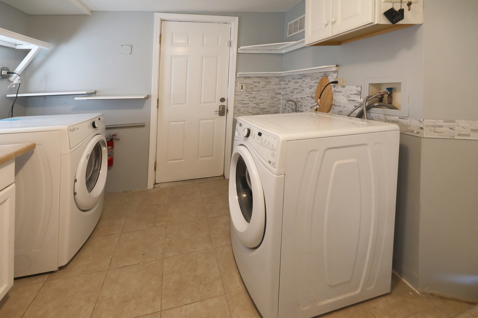 2015 Greenview Road Northbrook, IL 60062 - Photo 17 of 17 a utility room with dryer and washer