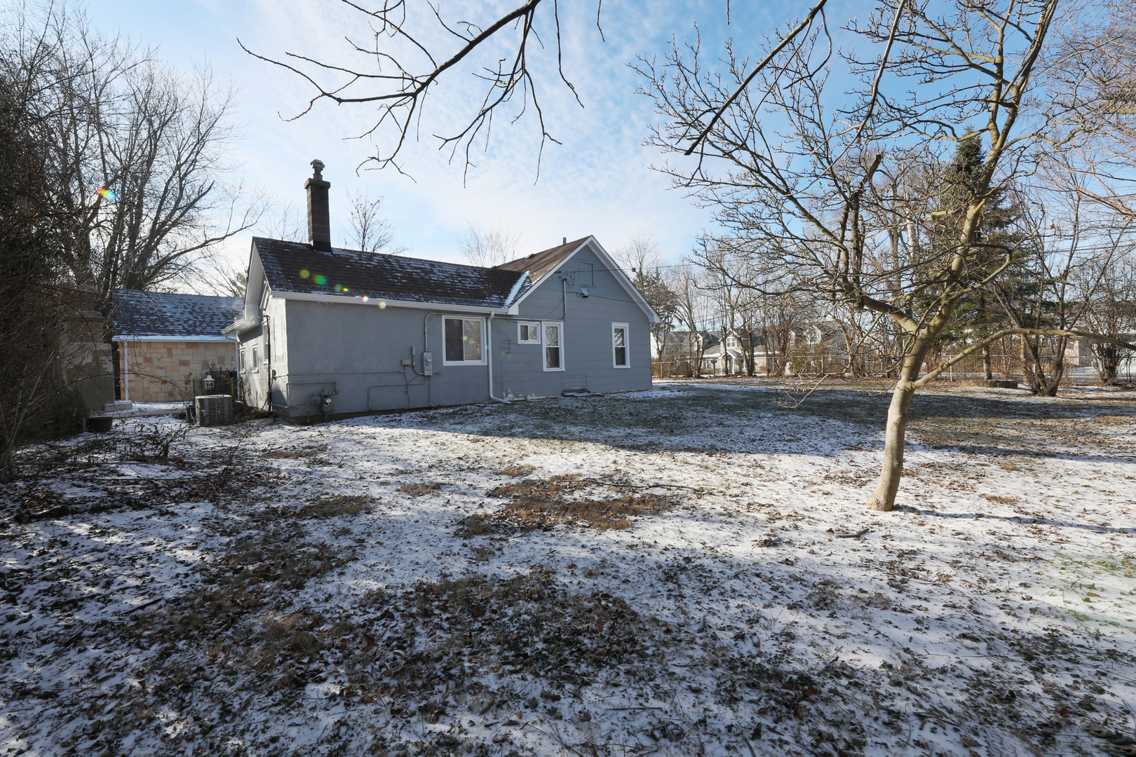 2015 Greenview Road Northbrook, IL 60062 - Photo 3 of 17 a front view of a house with a yard covered with trees