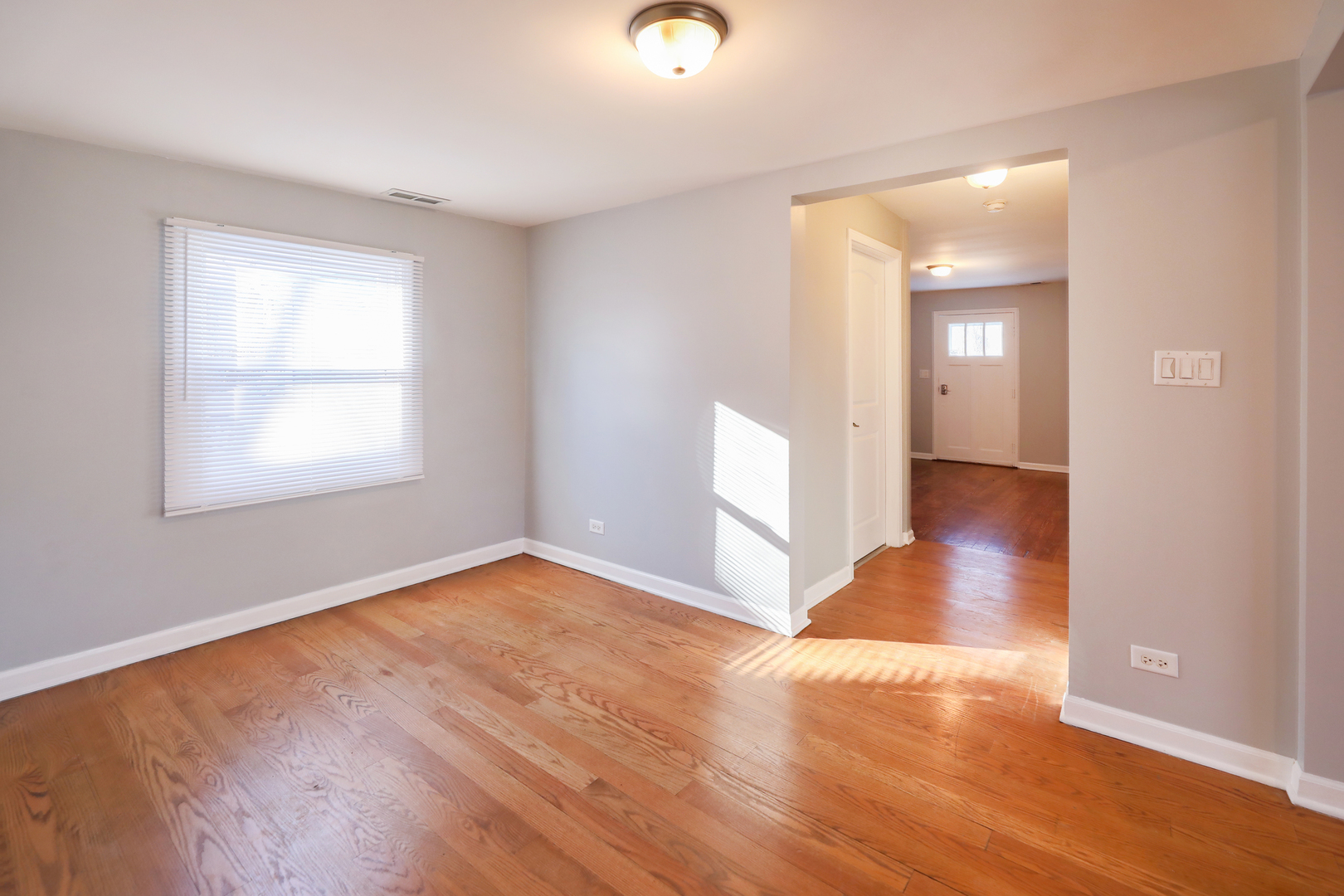 2015 Greenview Road Northbrook, IL 60062 - Photo 4 of 17 a view of an empty room with wooden floor and a window