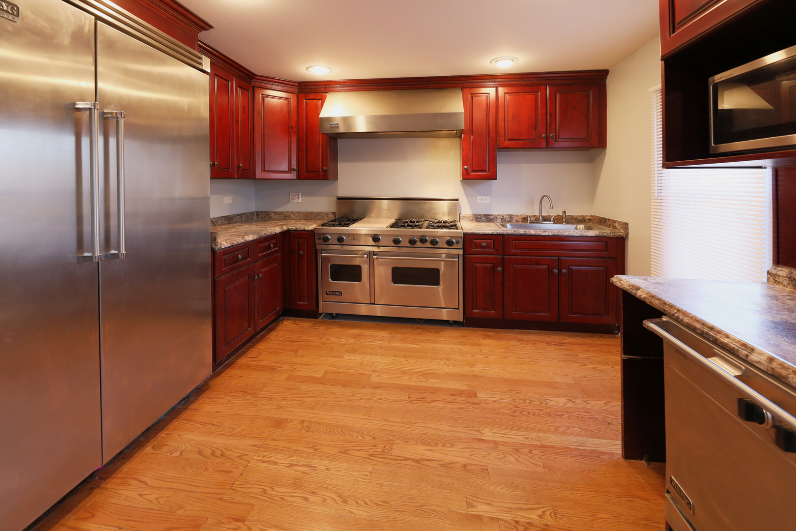 2015 Greenview Road Northbrook, IL 60062 - Photo 6 of 17 a kitchen with stainless steel appliances granite countertop a stove a sink and a refrigerator