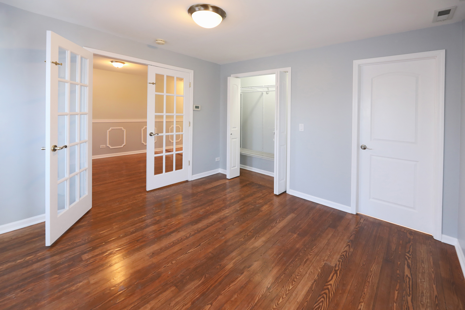 2015 Greenview Road Northbrook, IL 60062 - Photo 9 of 17 an empty room with wooden floor and windows