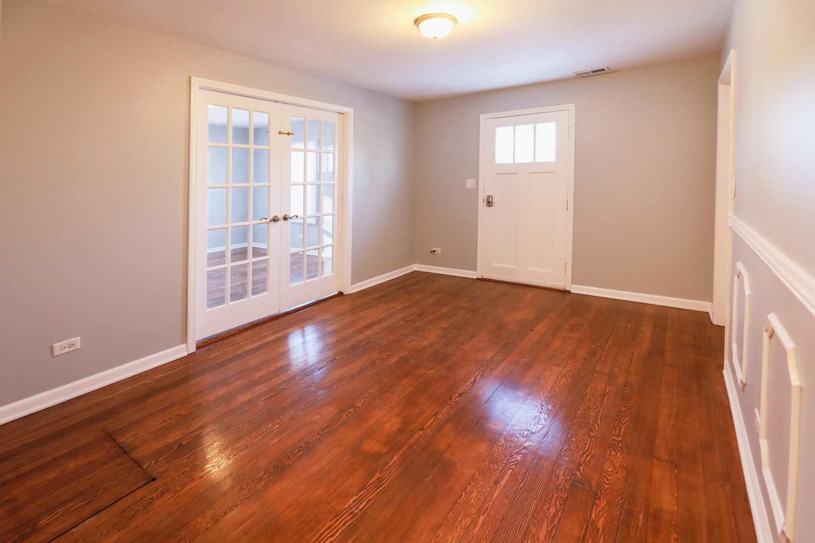 2015 Greenview Road Northbrook, IL 60062 - Photo 10 of 17 a view of an empty room with wooden floor and a window