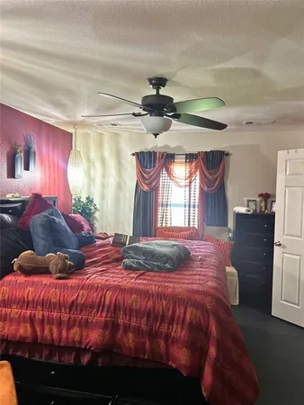 a bedroom with a bed and window