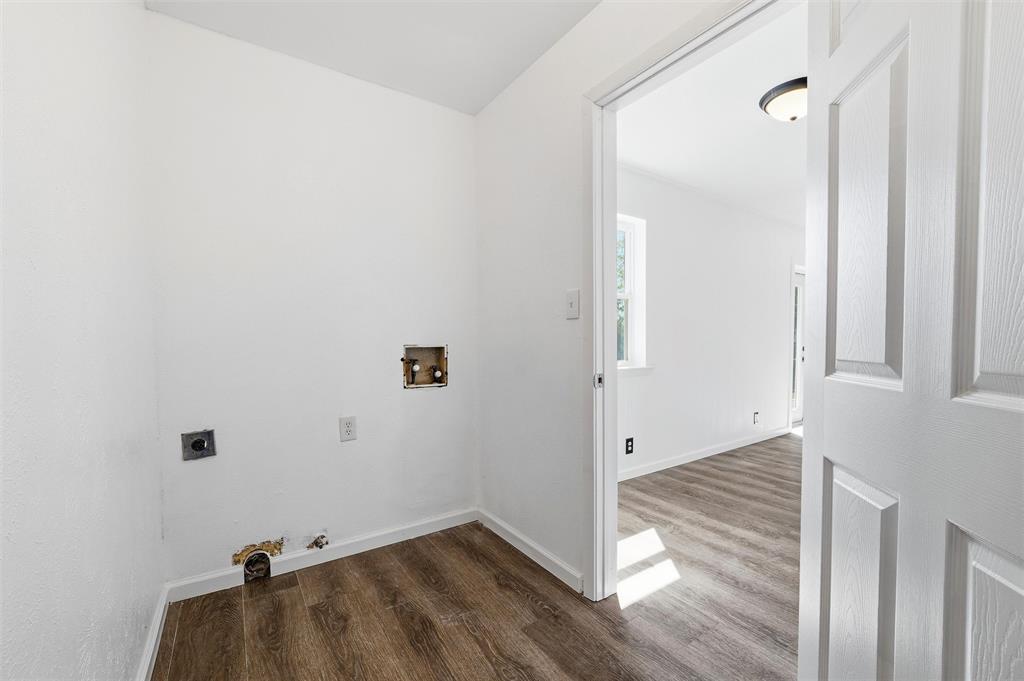 100 West Dilworth Road Italy, TX 76651 - Photo 17 of 38 a view of a room with wooden floor and a bathroom