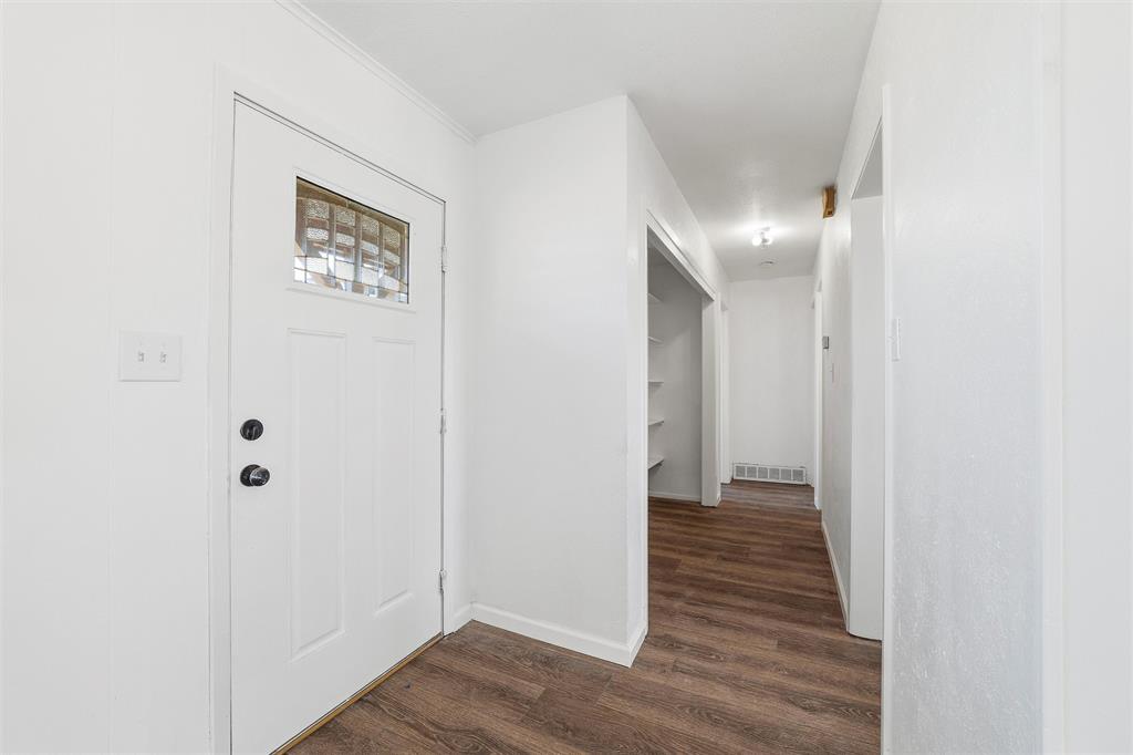 100 West Dilworth Road Italy, TX 76651 - Photo 3 of 38 a view of a hallway with wooden floor