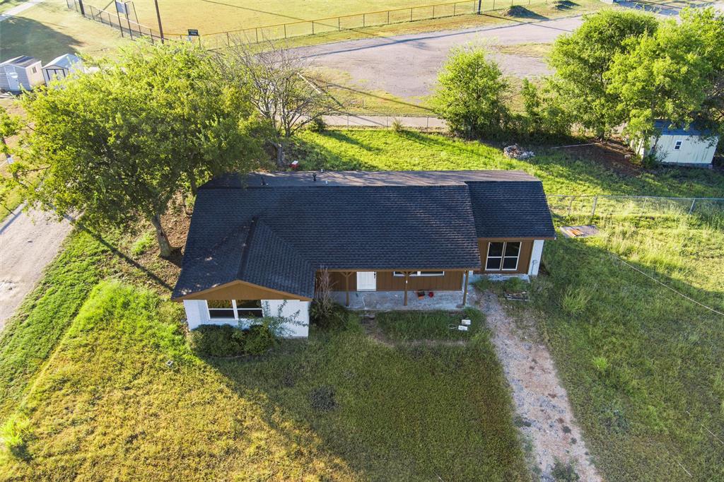 100 West Dilworth Road Italy, TX 76651 - Photo 31 of 38 a front view of a house with a yard