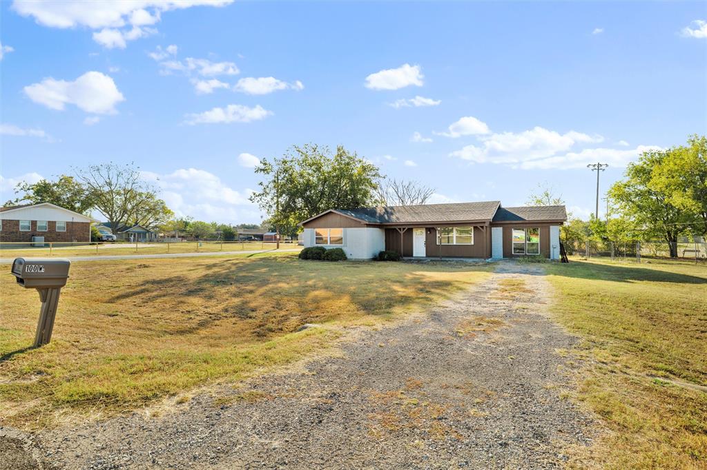 100 West Dilworth Road Italy, TX 76651 - Photo 33 of 38 a house view with swimming pool and trees in the background