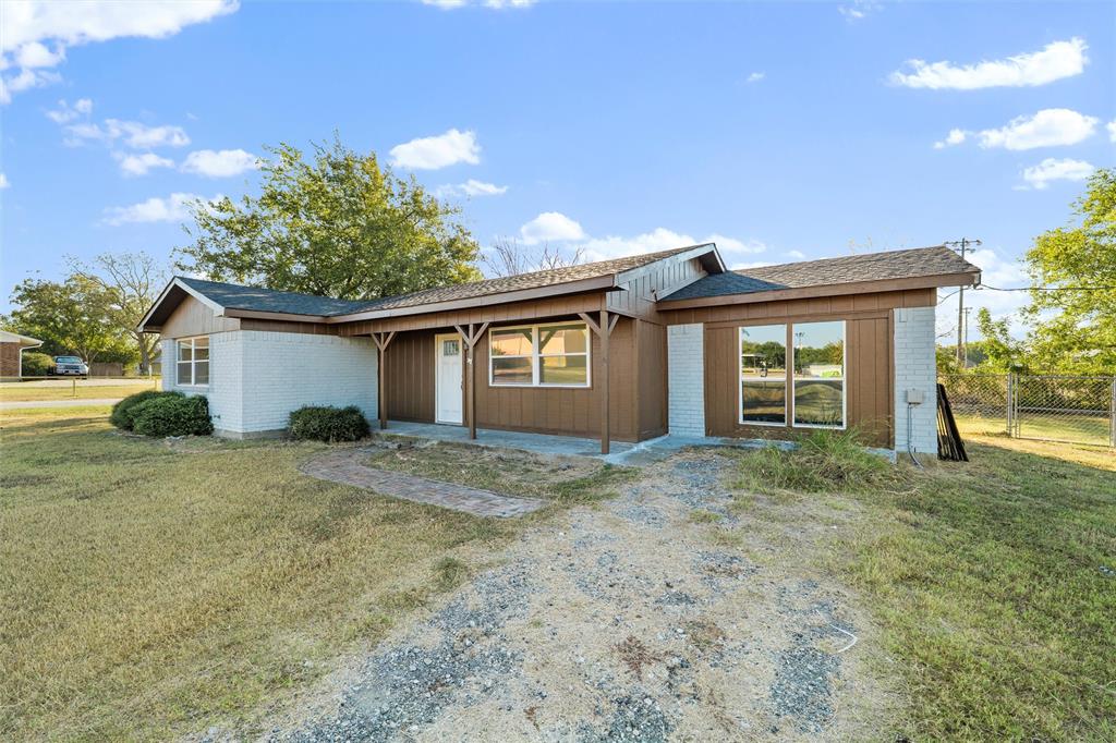100 West Dilworth Road Italy, TX 76651 - Photo 35 of 38 a view of a house with a yard and garage