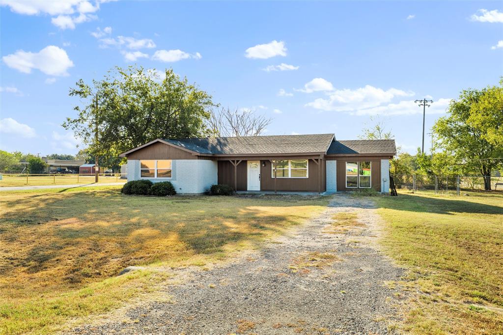 100 West Dilworth Road Italy, TX 76651 - Photo 38 of 38 a front view of a house with a yard and lake view