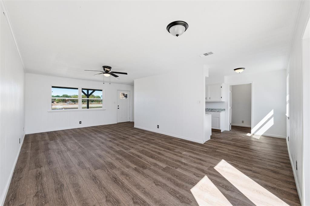 100 West Dilworth Road Italy, TX 76651 - Photo 6 of 38 a view of a livingroom with wooden floor