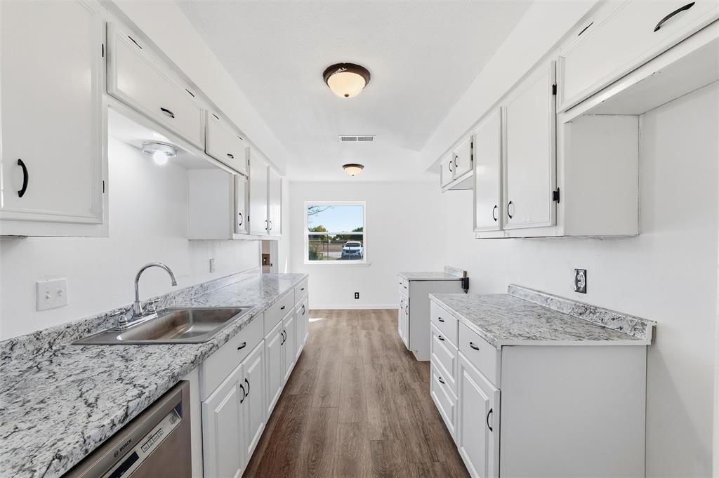 100 West Dilworth Road Italy, TX 76651 - Photo 9 of 38 a large kitchen with a sink and cabinets